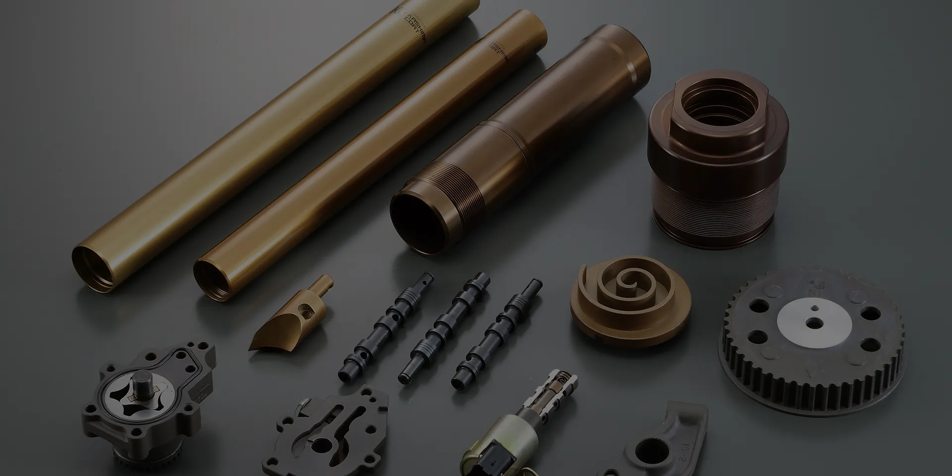 A collection of industrial parts treated with next-generation anodizing for improved corrosion and wear resistance.