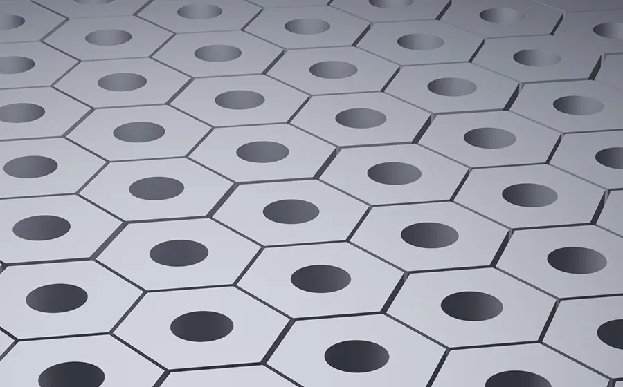 Close-up visualization of billions of hexagonal micro-pores in a ceramic-hard HV400 aluminum oxide surface coating.